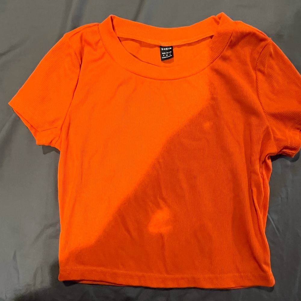 orange baby tee